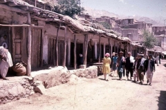 Tourists walking the Istalif market street, 1960s.
