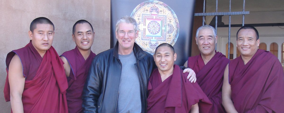 Richard Gere poses with monks from the Drepung Loseling Monastery at Seret & Sons Gallery