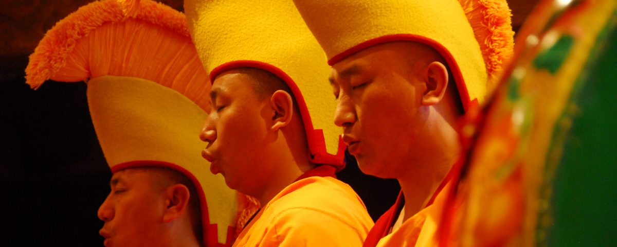 Monks from the Drepung Loseling Monastery sing during a Sand Mandala dismantling ceremony at Seret & Sons Gallery in Santa Fe, NM.